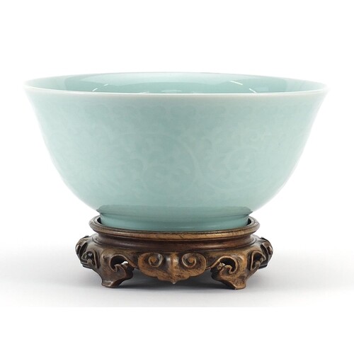 Chinese porcelain bowl on carved hardwood stand having a cel...