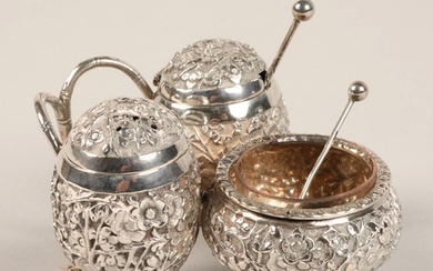 Chinese silver condiment set, with embossed prunus decoratio...