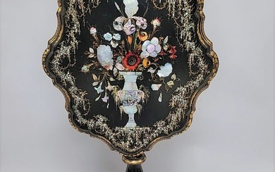 Circa 1850's Gilt & Mother of pearl inlaid paper mache tilt top table. Has elaborate vase with