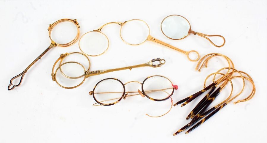 Collection of four yellow metal lorgnettes, a pair of spectacles and parts (qty)