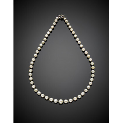 Cultured pearl graduated necklace with diamond and sapphire white gold clasp, also strung in white gold, pearl from mm 6.70…Read more