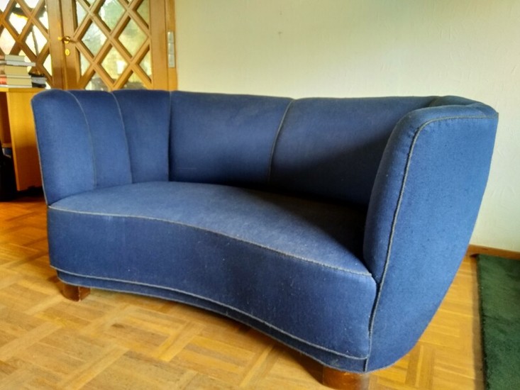 Danish furniture design: A slightly curved two-seater sofa, upholstered with blue fabric. L. 145. D. 90 cm.