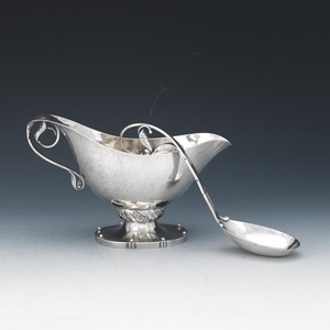 Georg Jensen Sterling Silver Hand Hammered Footed Sauce Boat and Ladle, "Blossom" Pattern, ca. 1915-1930
