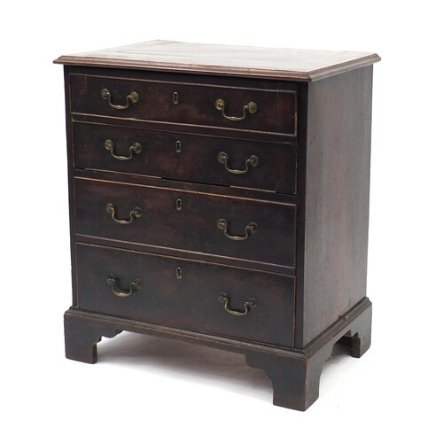 Georgian inlaid mahogany four drawer chest with bracket feet...
