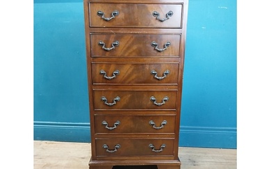 Mahogany chest of drawers with six drawers raised on bracket...