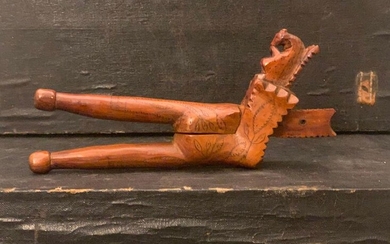 Nutcracker in fruit-wood, pliers model with incised decoration of two trees, on one of the branches is carved a squirrel. Alpine work. 19th century.