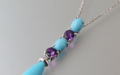 Pendant and its chain in white gold 750 thousandths, it presents three synthetic turquoises of cabochon and pear size falling alternately of two amethyst round size.