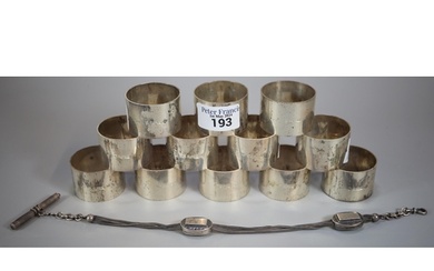 Set of twelve Queen Elizabeth II silver napkin rings. 14 tr...