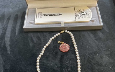 TAKARA PEARL; a cultured pearl necklace with 9ct yellow gold...