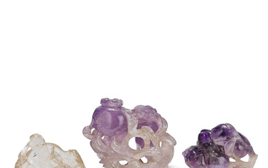 TWO CARVED AMETHYST 'FRUIT' CARVINGS AND A ROCK CRYSTAL 'LI...