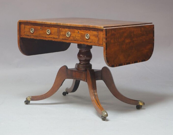 Two Regency mahogany tilt-top breakfast tables, each with rectangular top above turned central column and three splayed feet to brass caps and casters, 120x73x71cm and 74x101x90cm (2)