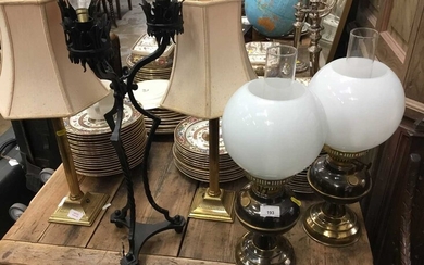 Two pairs of brass oil lamp style table lamps, two pairs of brass candlesticks table lamps and a gothic wrought metal lamp