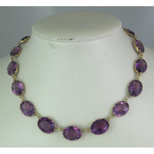 Victorian amethyst set necklace of graduated claw set stones...