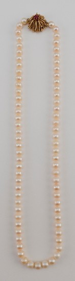 14KT GOLD, RUBY AND CULTURED PEARL NECKLACE Cream-colored pearls each approx. 7mm. Naturalistic clasp set with six small rubies and...
