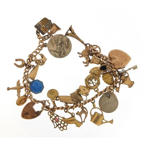 9ct gold charm bracelet with a selection of gold and metal c...