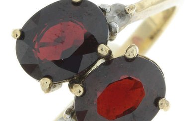 9ct gold garnet two-stone ring, with colourless gem highlight