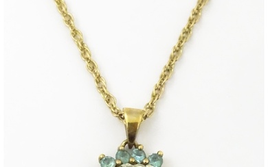 9ct gold pendant set with white and aqua coloured stones, wi...