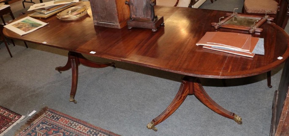 A 20th century mahogany twin pedestal D end dining table,...