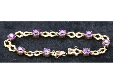 A 9ct gold ladies bracelet set with 8 round amethysts, 18cm ...