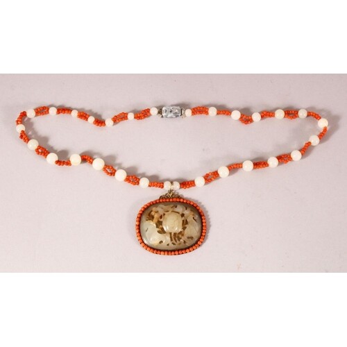 A CHINESE JADE AND CORAL PENDANT AND CHAIN, the pendant with...