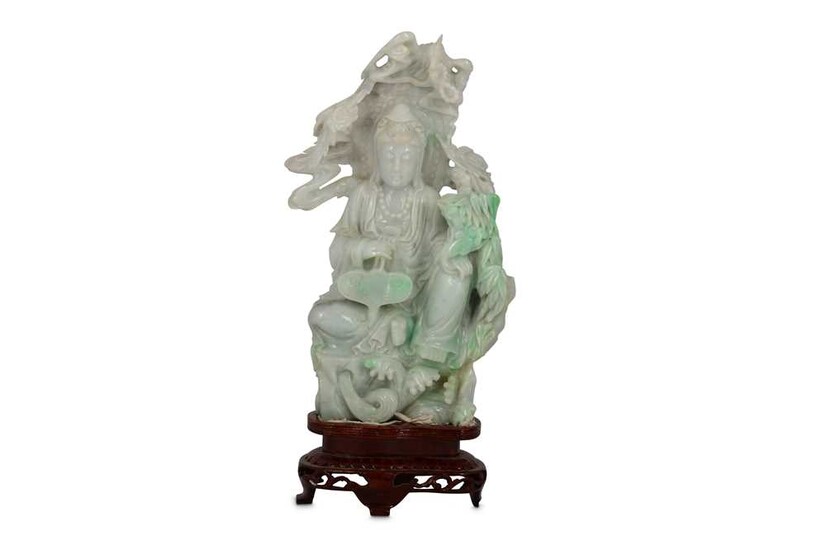 A CHINESE JADEITE CARVING OF A SEATED GUANYIN.