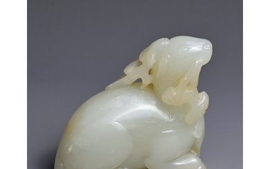 A CHINESE WHITE JADE CARVING OF A DEER, QING DYNASTY. Carved...