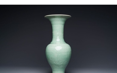 A Chinese Longquan celadon baluster vase with anhua floral d...