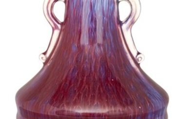 A Chinese flambé vase, late Qing dynasty/Republic period, of tapered form with ribbed shoulders rising to a narrow neck with lipped rim, flanked by a paif of ruyi handles, covered overall in streaky red and lilac glaze, six-character apocryphal...