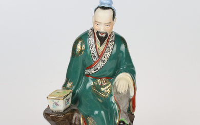 A Chinese man figurine, hand-painted porcelain, probably China.