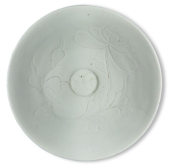 A Chinese porcelain Qingbai 'lotus' bowl, late 19th century, on short foot with slightly curved sides rising to a slightly everted rim, the interior decorated with incised lotus blooms and leafy stems, 20cm diameter