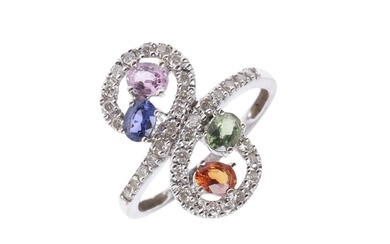 A DIAMOND AND SAPPHIRE RING. formed with oval-shaped multi c...