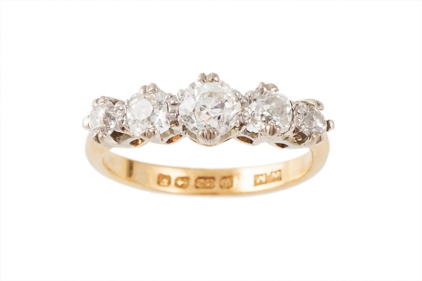 A FIVE STONE DIAMOND RING, the graduating old cut diamonds m...