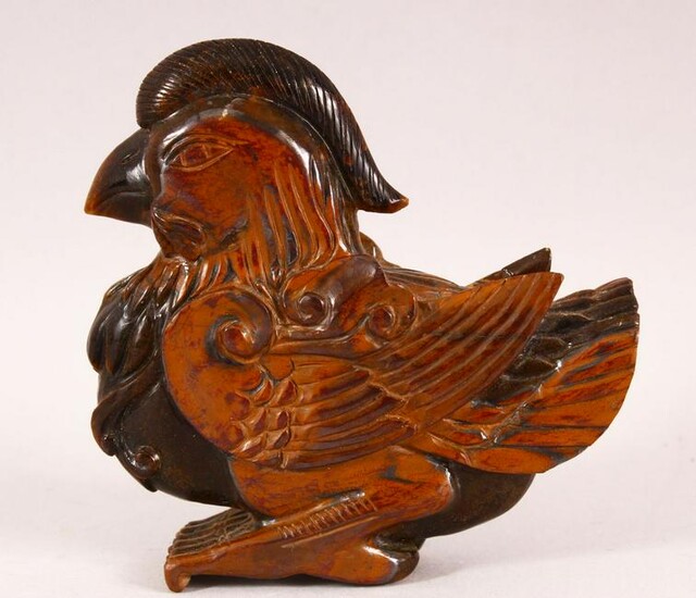 A GOOD CHINESE CARVED TIGERS EYE FIGURE OF A BIRD