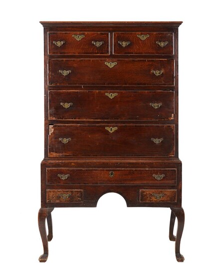A George II oak and mahogany banded chest on stand