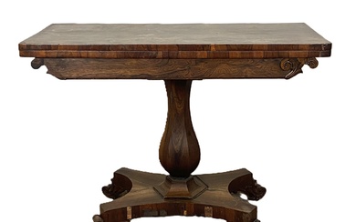 A George IV rosewood tea table, circa 1820, with a rounded rectangular fold-over top, rotating to