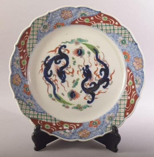 A LARGE JAPANESE PORCELAIN DISH AND STAND, decorated in