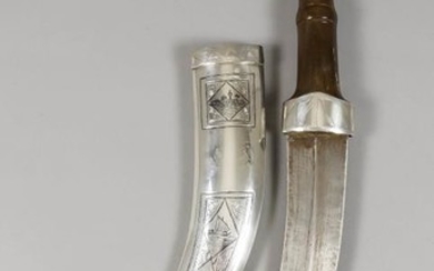 A Middle Eastern Jambiya Dagger, 20th Century, with wooden...