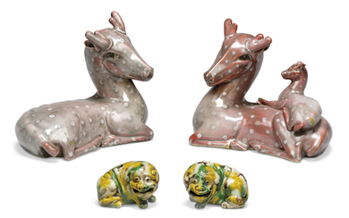 A PAIR OF CHINESE BISCUIT-ENAMELLED MODELS OF DOGS AND A PAIR OF CHINESE AUBERGINE-GLAZED MODELS OF DEER, KANGXI PERIOD (1662-1722) AND 19TH CENTURY