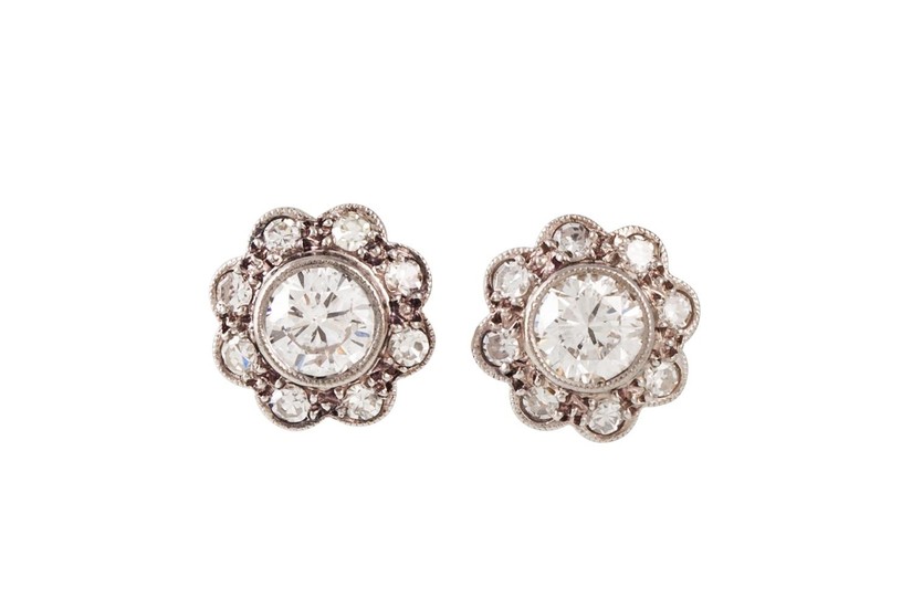 A PAIR OF DIAMOND DAISY CLUSTER EARRINGS, set with circular ...