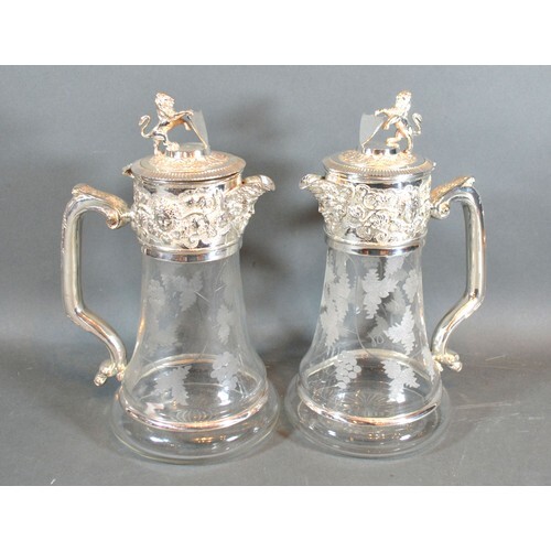 A Pair of Silver Plated and Engraved Glass Claret Jugs each ...