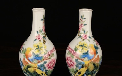 A Pair of Small Chinese Republican Vases. The baluster bodies decorated in vibrant enamels with bird