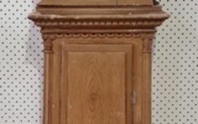 A STAINED PINE LONG CASED CLOCK