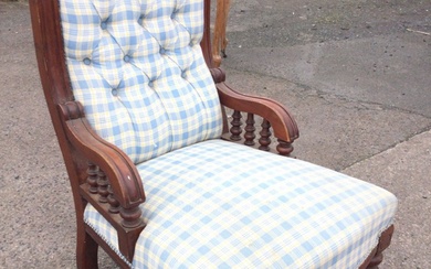 A Victorian mahogany upholstered armchair with rectangular buttoned back and...