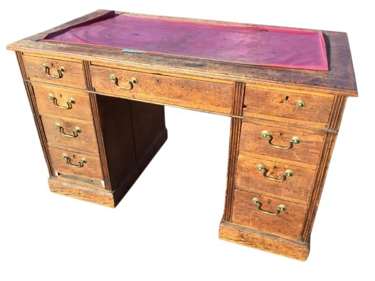 A Victorian oak kneehole desk, the rectangular moulded top...