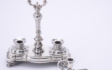 A Victorian silver shaped oval chamberstick and snuffer by Henry Wilkinson & Co.