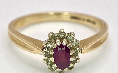 A Vintage 9K Yellow Gold Diamond and Ruby Ring....