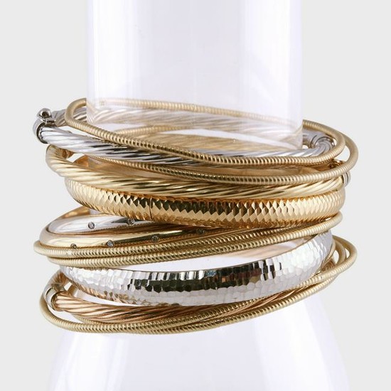 A collection of fourteen karat gold bangle bracelets