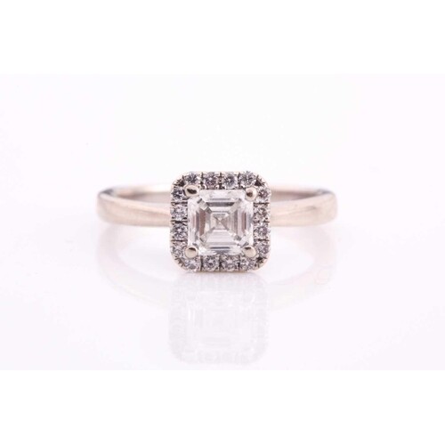 A diamond halo ring, with a claw set, central Asscher cut di...
