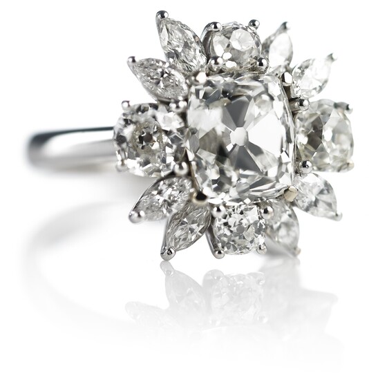 A diamond ring with a cushion-cut diamond weighing app. 3.64 ct. and marquise and old-cut diamonds, totalling app. 6.37 ct., mounted in 18k white gold.