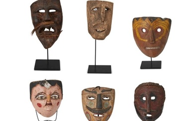A group of Mexican carved wood masks
